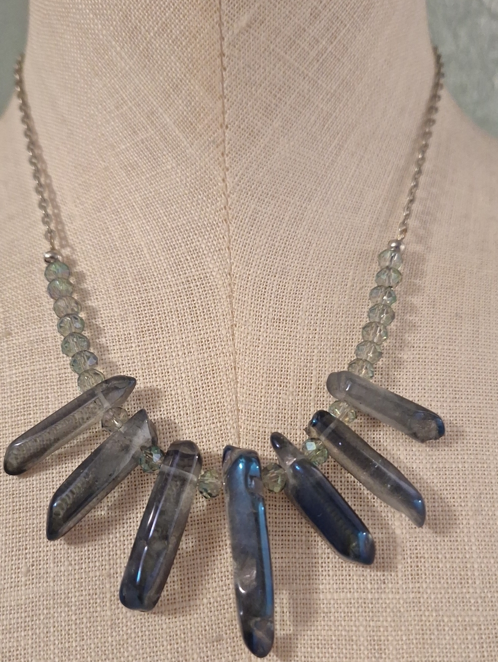 Rainbow Titanium Daggers separated by blue aurora Borealis Faceted Beads